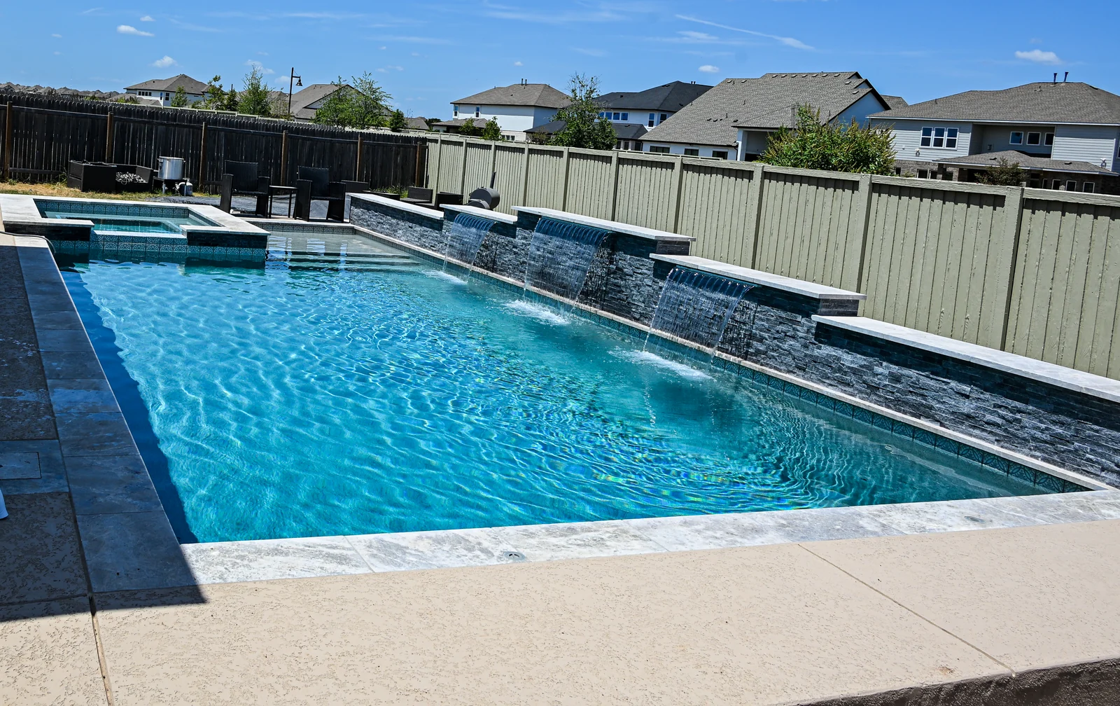 Full length of a rectangular pool seen from the far corner of the deck