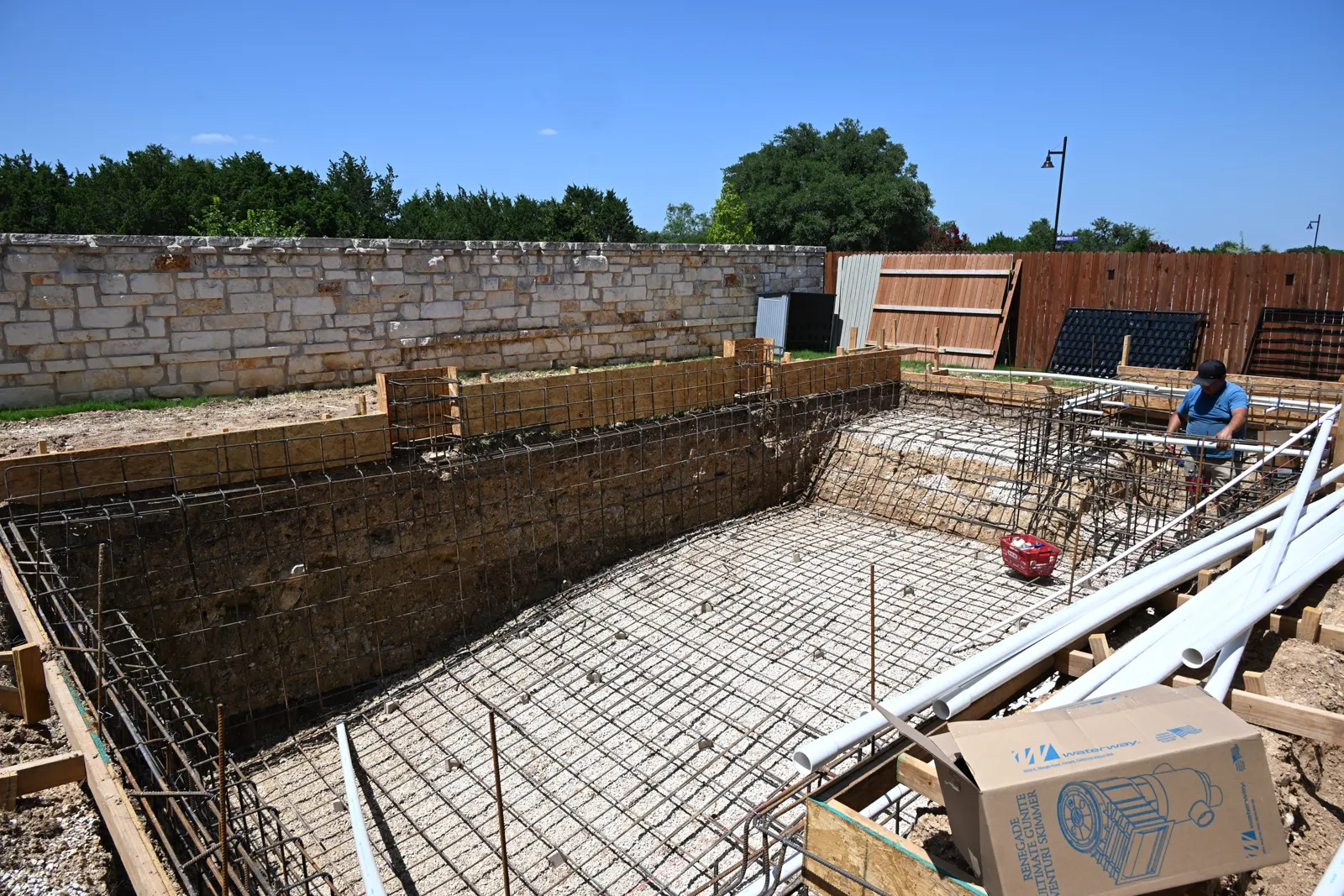Rebar and wood forms for a pool with a raised spa
